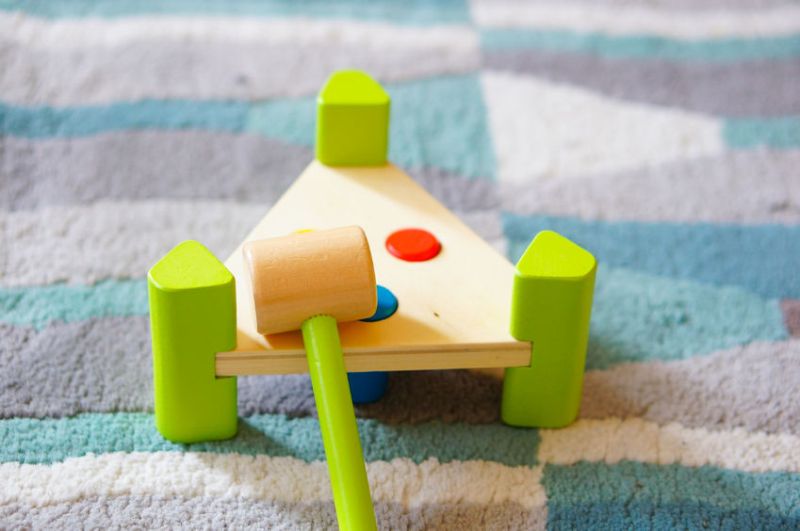 54343585 - wooden hammer toy on carpet