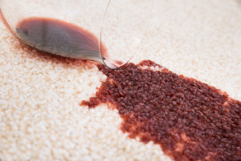 36721105 - close-up of red wine spilled from glass on carpet