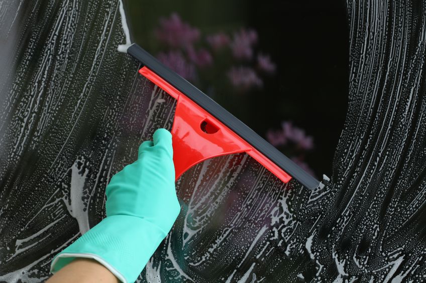 15165430 - housework with red squeegee for glass, window cleaning